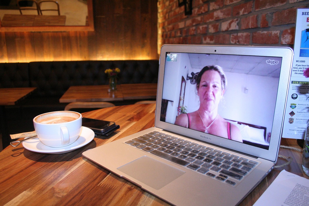 A person working at a laptop in a video call